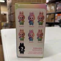 Box with cartoon character design on a white surface with cardboard boxes in the background