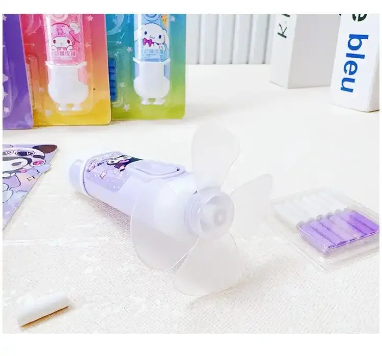 Small white electronic device with cartoon character on a white surface