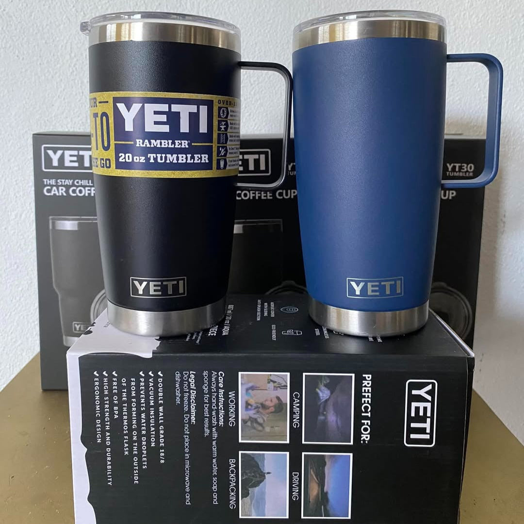 Two YETI tumblers, one black and one blue, on a white background.