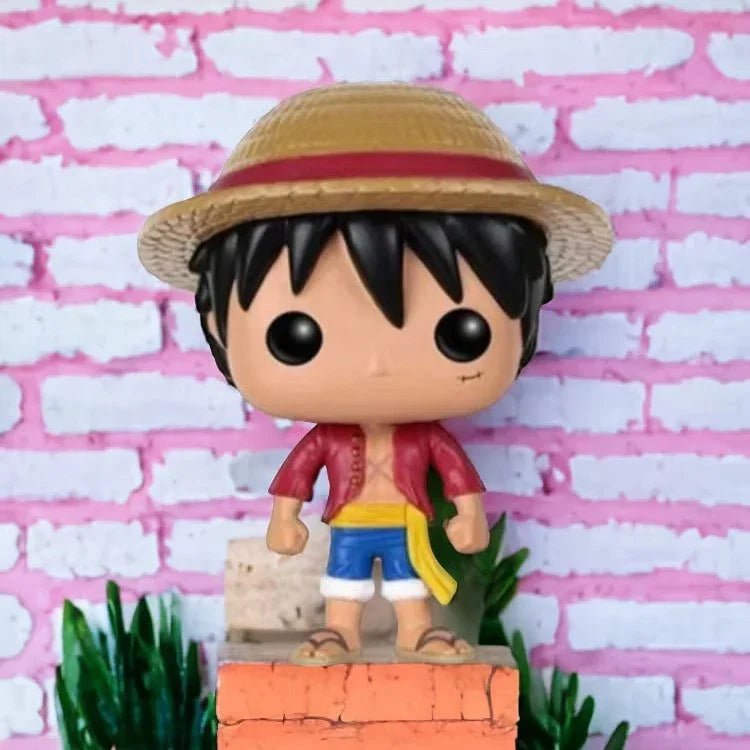 Funko Pop! vinyl figure of a character with a straw hat against a pink brick wall background