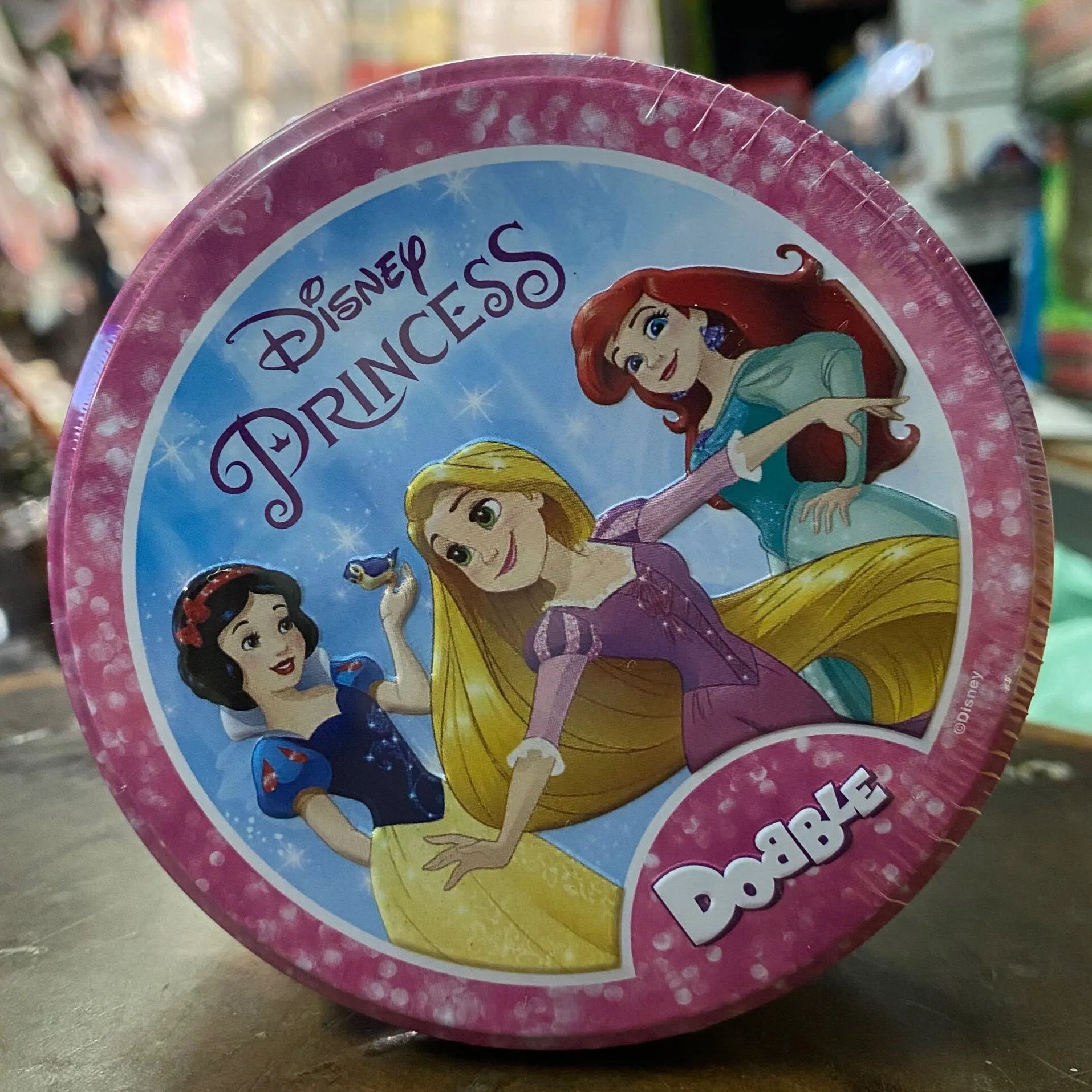 Disney Princess-themed product with characters on a pink and blue background