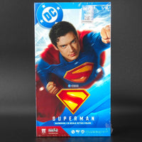 Superman action figure packaging with DC logo on a dark background