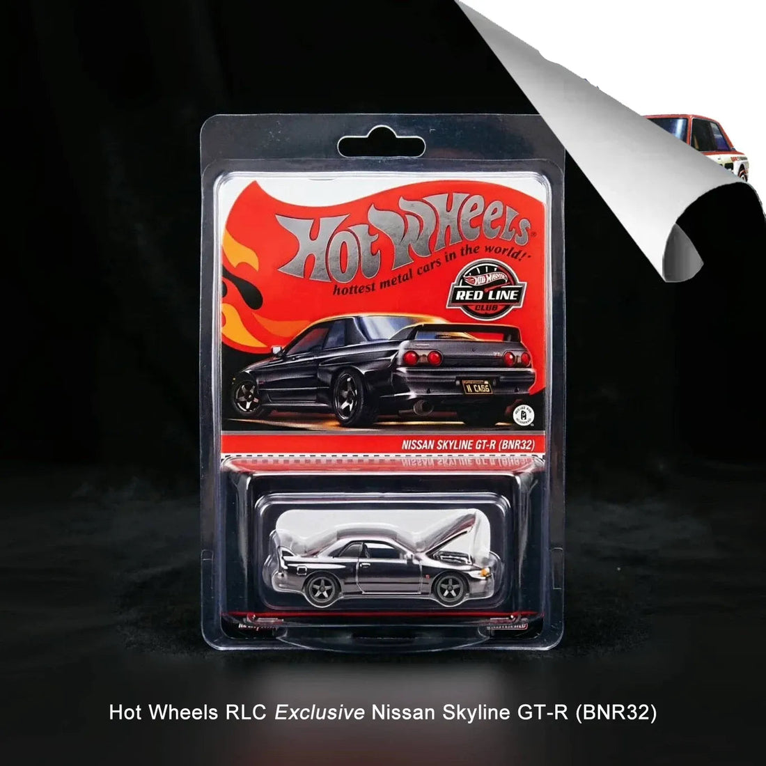 Hot Wheels RLC Exclusive Nissan Skyline GT-R toy model car in its original blister packaging, displayed against a dark background with a promotional corner graphic.